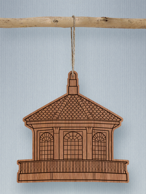 A hanging wooden ornament of the Silent Unity cupola